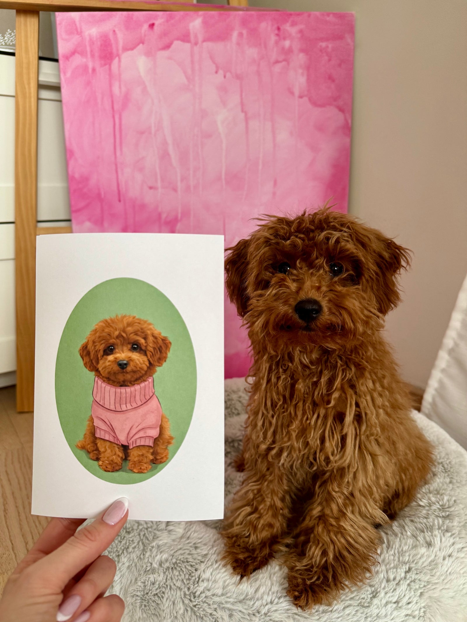 Customer review photo of a vintage custom dog poster held beside the dog